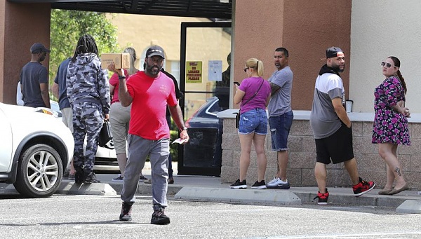 Click image for larger version

Name:	A man leaves a gun store in Casselberry, Fla., in March. (Joe Burbank - AP.jpg
Views:	115
Size:	81.5 KB
ID:	45571